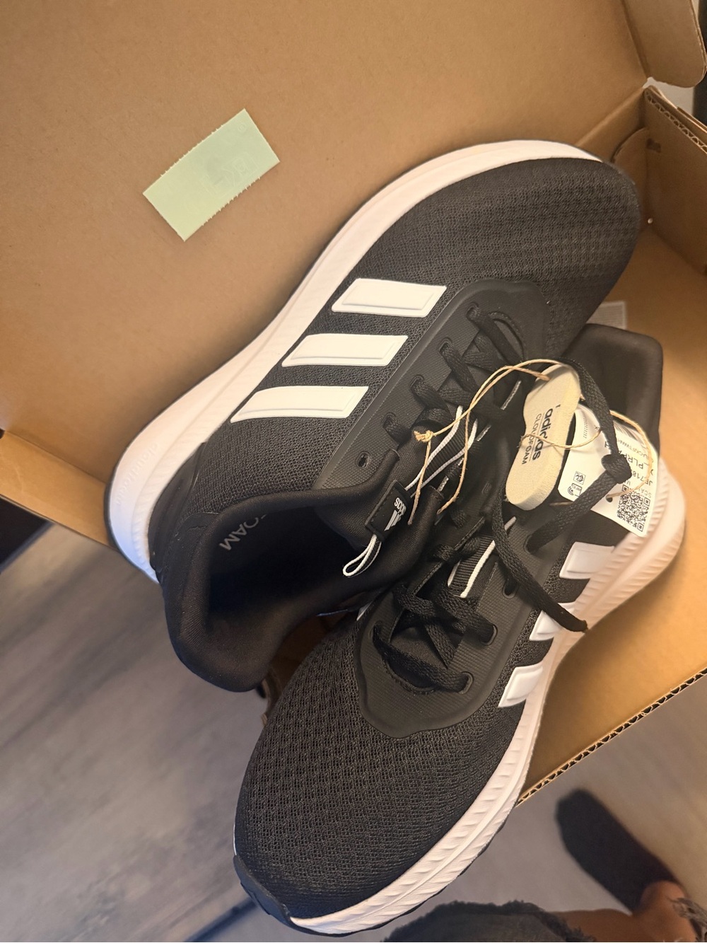 Adidas Women's Black Running Shoes with White Stripes